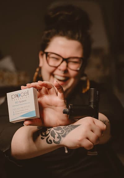 Erika holding Procell microchanneling device and MD serum at Hideaway Spa Windsor
